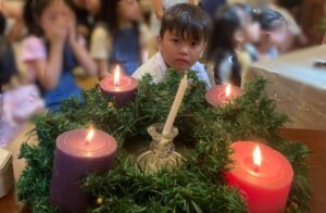 children at prayer table with advent wreath v2
